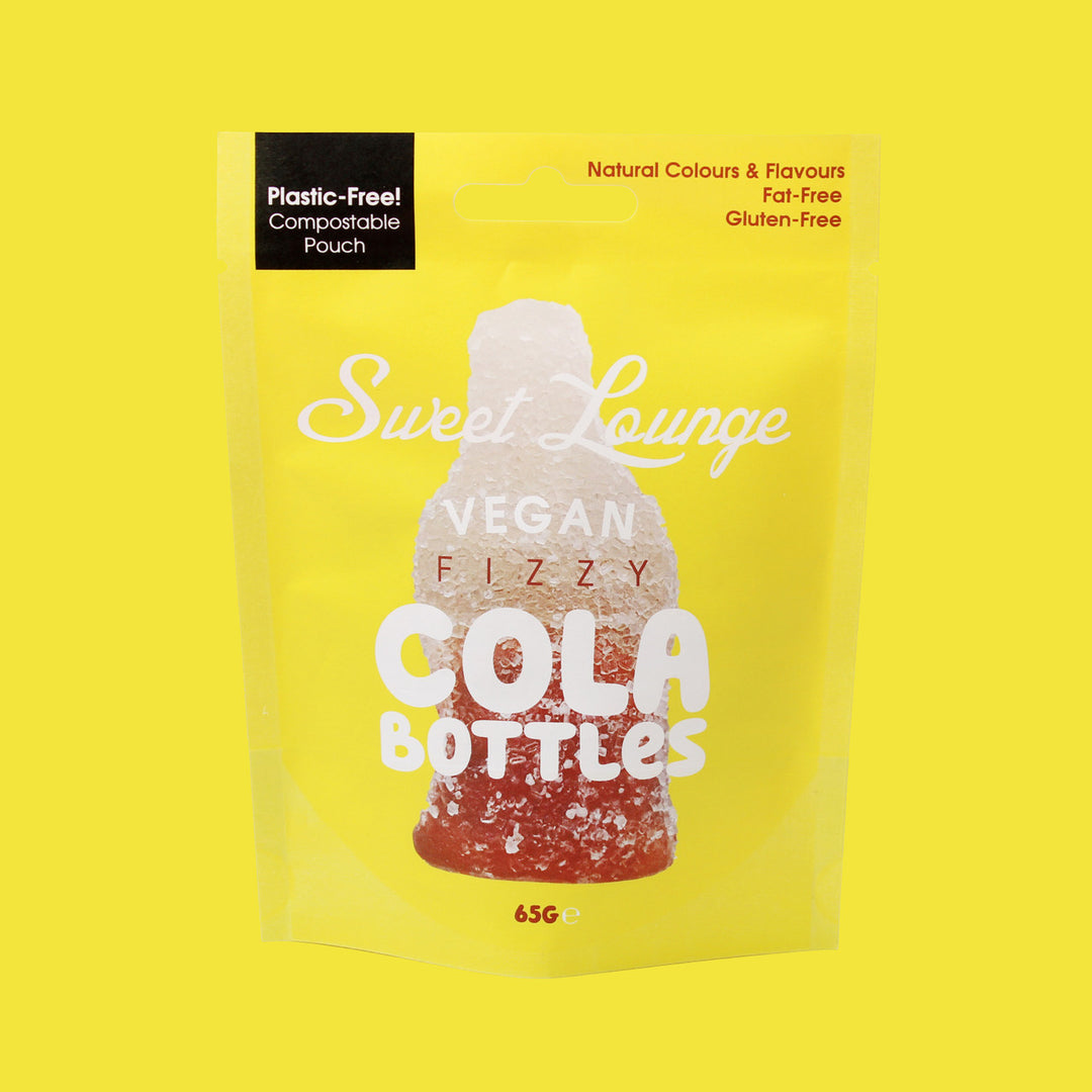 Packaging of Sweet Lounge Vegan Fizzy Cola Bottles on a yellow background plastic free packaging